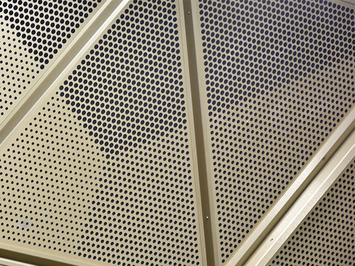 Acoustic anodised gold cladding at Gatwick Station